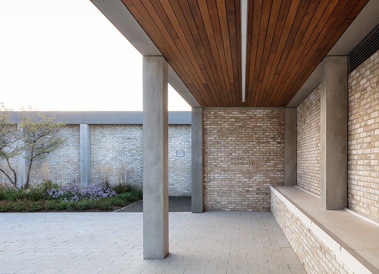 The colonnade features timber soffit and exquisitely detailed brick and pre cast concrete, 03 of 21.