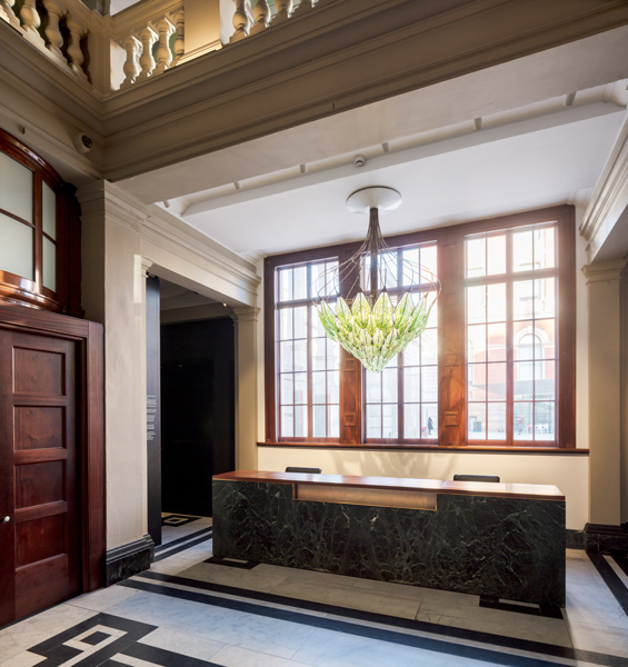 Finely crafted reception desk of marble and timber, 04 of 06.