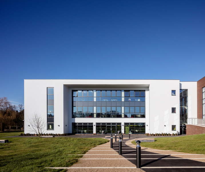 The new facade features white render and extensive glazing, 04 of 07.