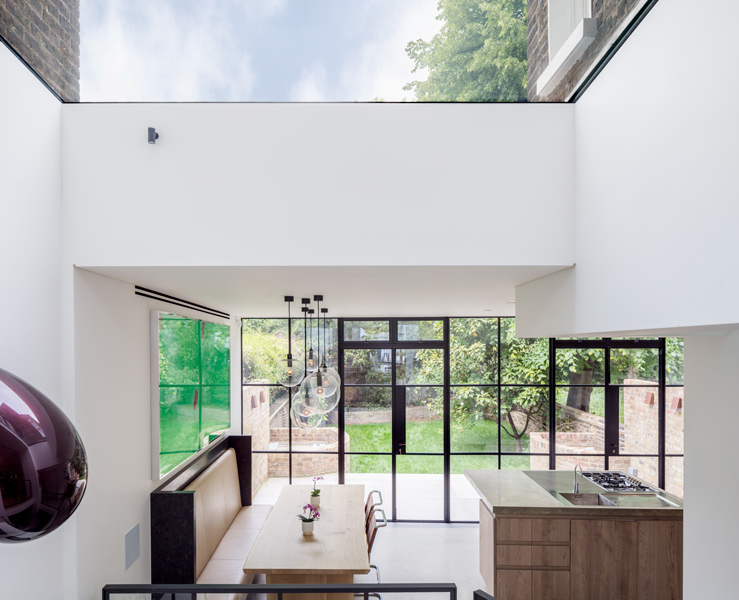 View of the kitchen from the atrium showing the rooflight, 07 of 28.