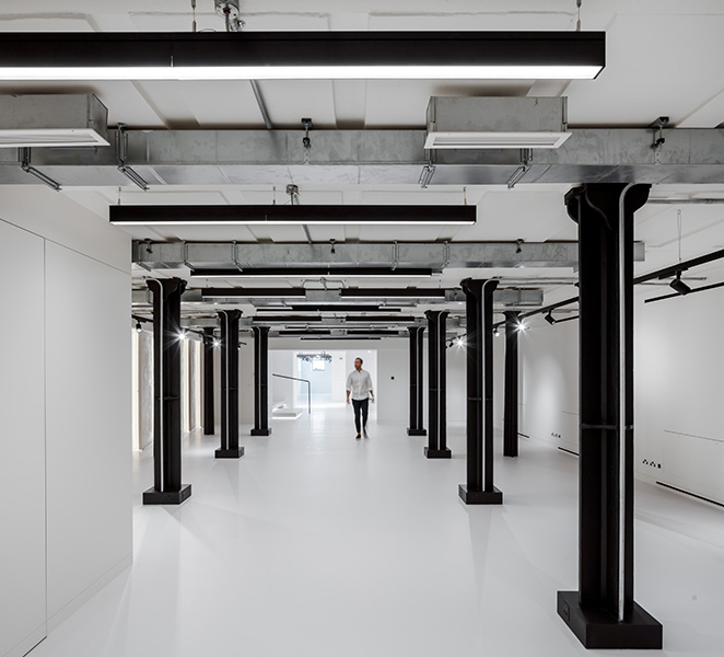 Gallery space with exposed existing iron columns, 14 of 17.