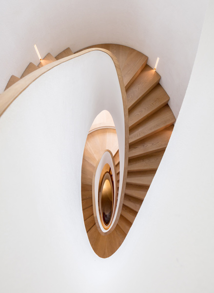 View looking down the sculptural staircase, 24 of 27. 